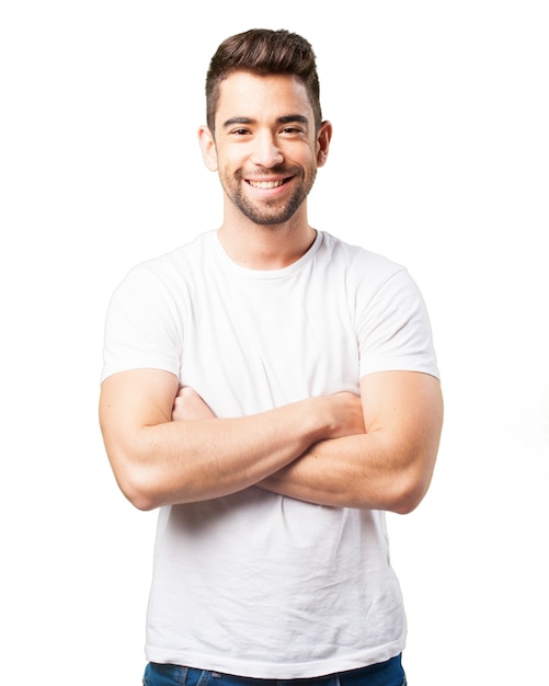 Man smiling with arms crossed Photo | Free Download