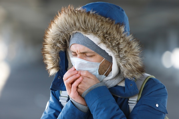 Premium Photo Man Sneezing Coughing Wearing Medical Protective Mask