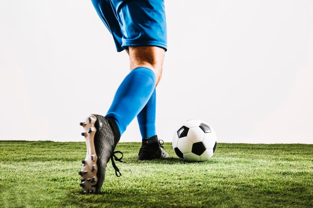 Free Photo | Man in soccer boots kicking ball