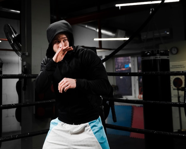 Free Photo Man In Sportswear Training In Boxing Ring