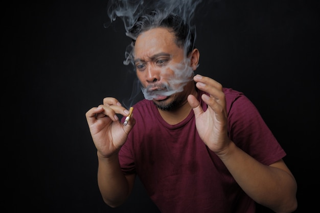 Premium Photo | Man surprised after smoking a cigarette