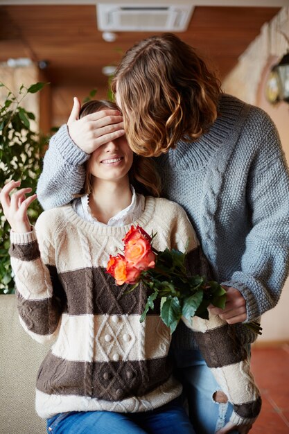 Free Photo Man Surprising His Wife With Flowers