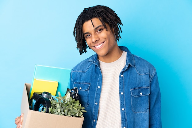 Premium Photo | Man taking a box full of things and making a move