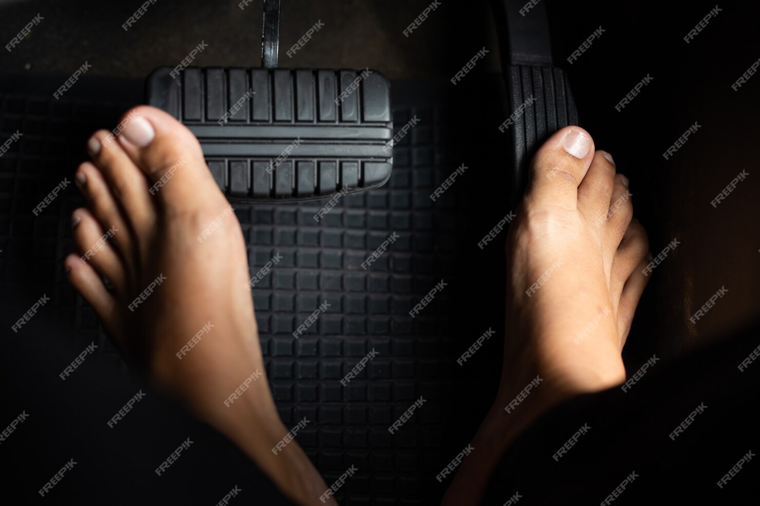 premium-photo-man-taking-off-his-shoes-while-driving