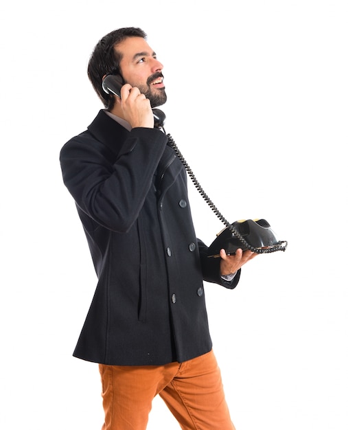 Free Photo | Man talking to vintage phone