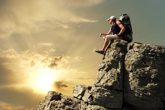 Premium Photo | Man tourist on top of mountain