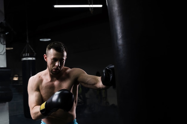 Free Photo | Man training hard for a boxing competition