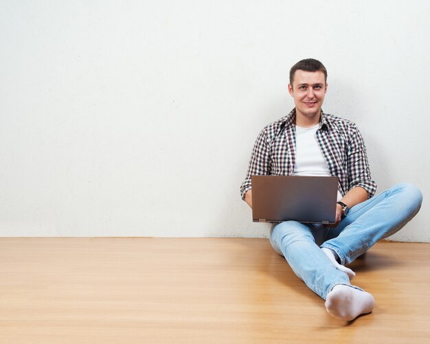 Man using his laptop computer Premium Photo