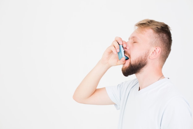 Man using inhaler | Free Photo