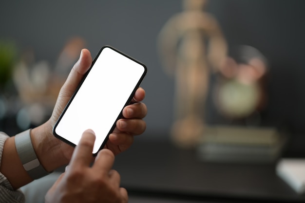 Man using mobile phone at office, blank screen mobile smart phone Premium Photo