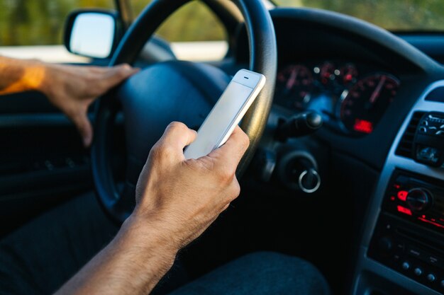 Man using phone while driving Premium Photo