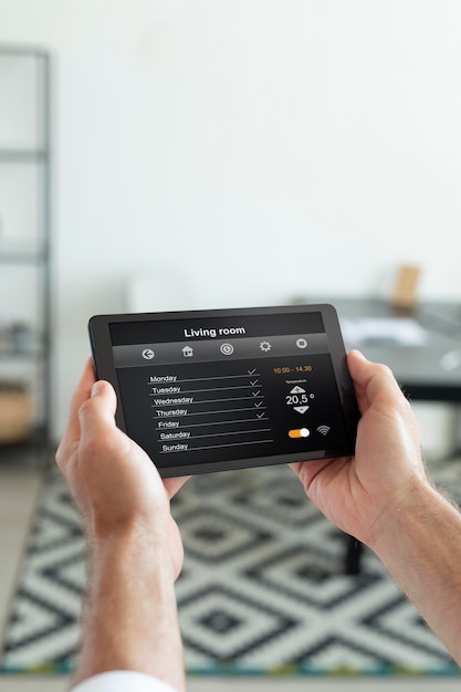 Premium Photo Man Using A Smart Home Tablet Indoors