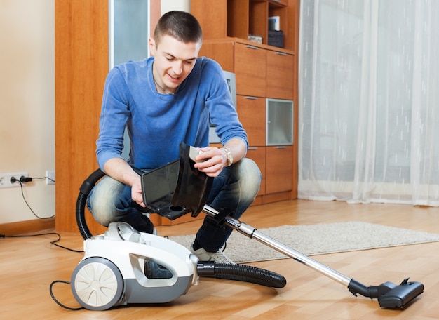 man vacuuming living room