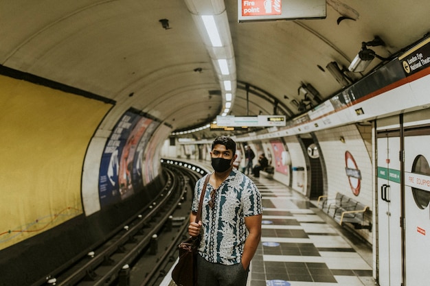 Premium Photo | Man waiting for a train on a platform