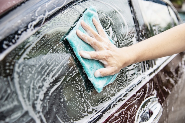Man wash car using shampoo Free Photo