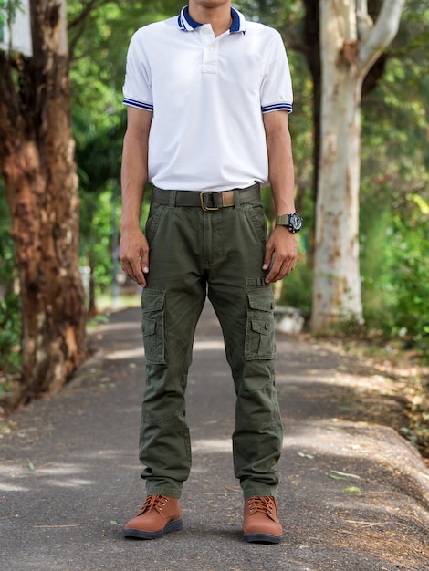 Premium Photo | Man wearing cargo pants standing in the nature park
