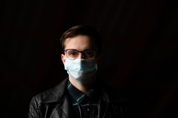 Premium Photo Man Wearing Mask And Glasses To Prevent Infection