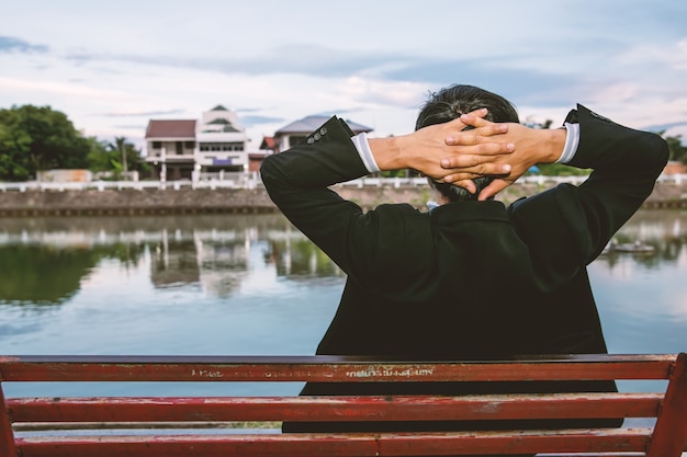 Man Wearing Suit Sitting On Park Bench Photo Premium Download