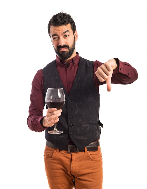 Man wearing waistcoat holding a wine glass | Free Photo