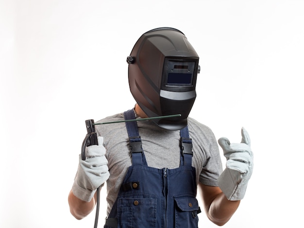 Premium Photo | A man in a welding mask, robotic clothes and gloves ...