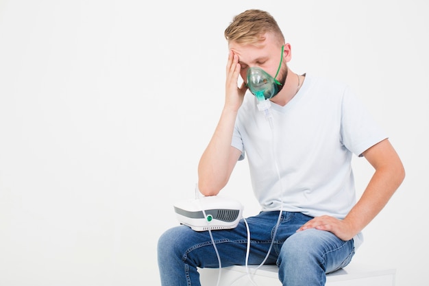 Man with asthma nebulizer Free Photo
