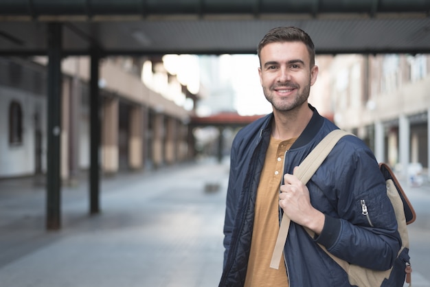 Premium Photo | Man with backpack smiling student