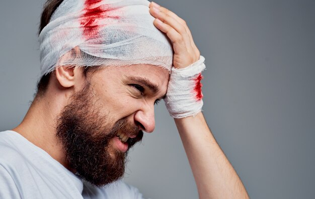 Premium Photo A Man With A Bandaged Head Blood Resuscitation Surgery Model Gauze On His Arm