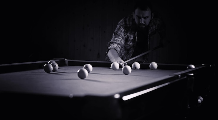 Premium Photo | A man with a beard plays a big billiard. party in 12 ...