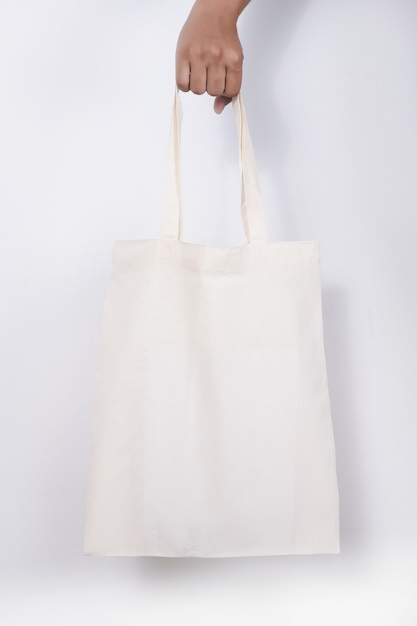Premium Photo | Man with cotton bag shopping bags eco mockup