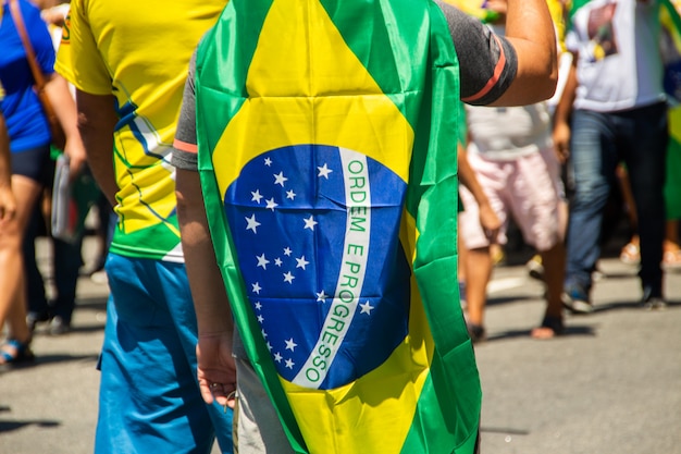 Premium Photo Man With The Flag Of Brazil During A March In Rio De Janeiro