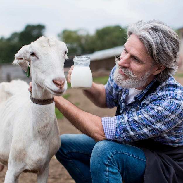 Free Photo | Man with fresh goat milk