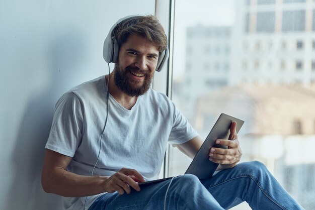 Premium Photo | Man with headphones with laptop entertainment relaxation