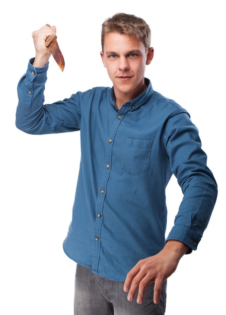 Man with a knife in his hand Free Photo