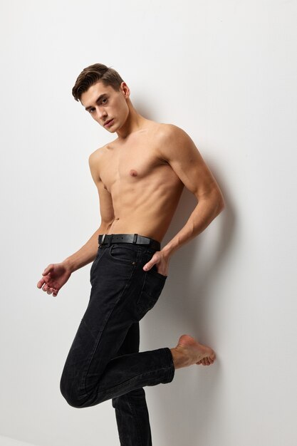 Premium Photo A Man With A Naked Torso In Black Trousers Posing Portrait Of Self Confidence