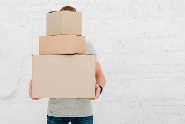 Free Photo | Man with stack of boxes