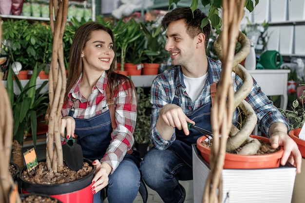 Premium Photo | Man and woman in a flower shop