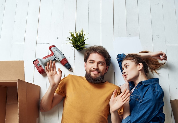 Premium Photo | Man and woman home renovation in an apartment with boxes