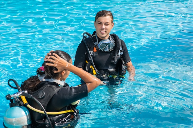 Premium Photo | Man and woman in scuba gear and equipment