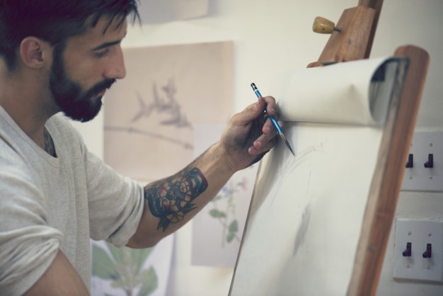 Premium Photo | Man working on a drawing