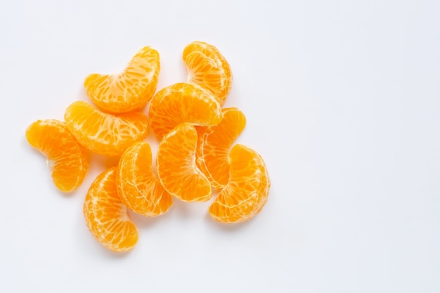 Mandarin segments, fresh  orange isolated on white. Premium Photo