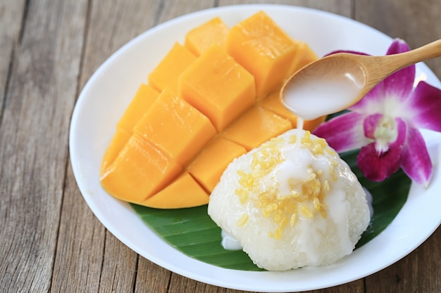 Premium Photo | Mango and sticky rice is popular traditional dessert.