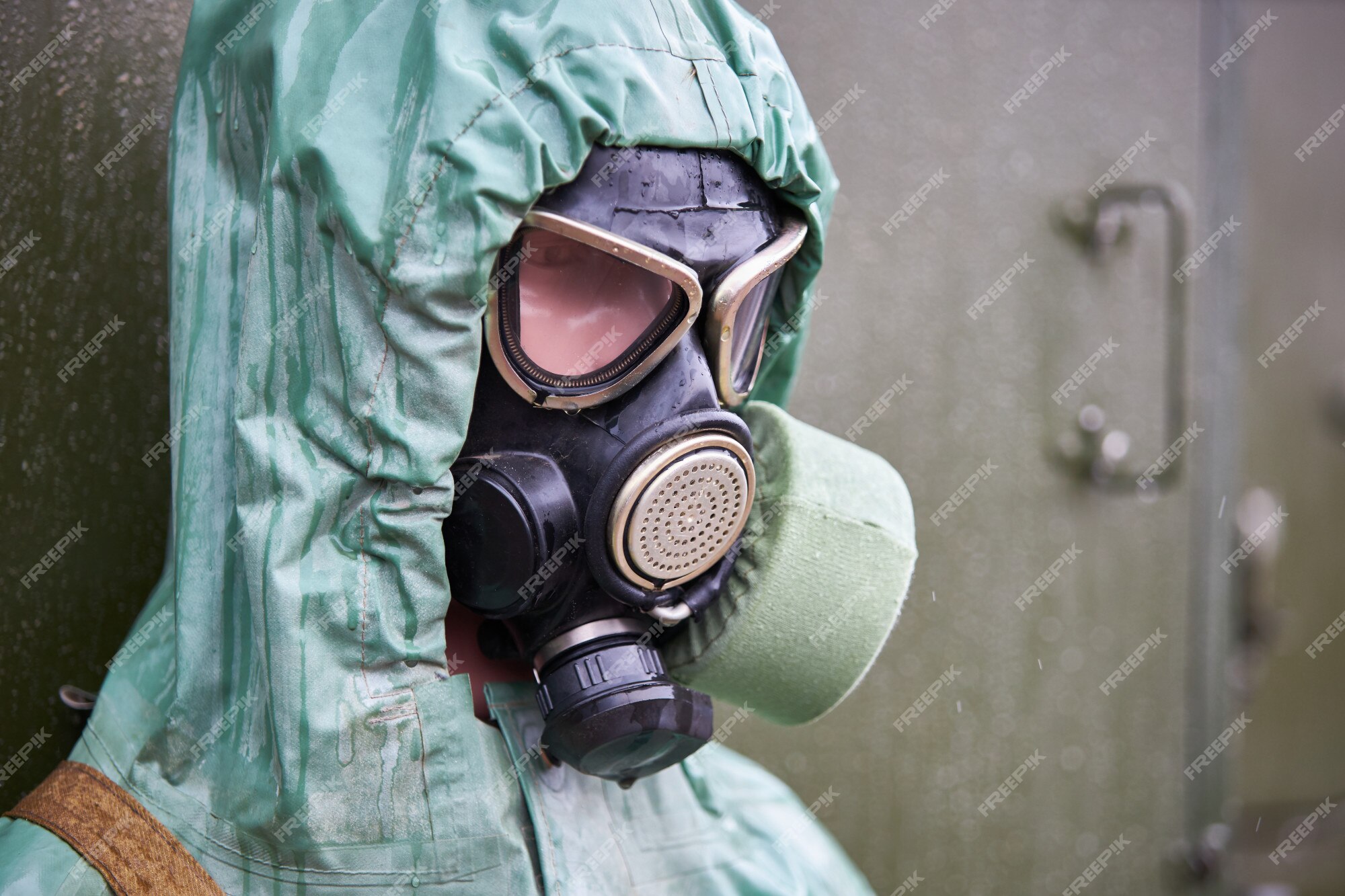 Premium Photo | Mannequin dressed in green rubber chemical protection ...