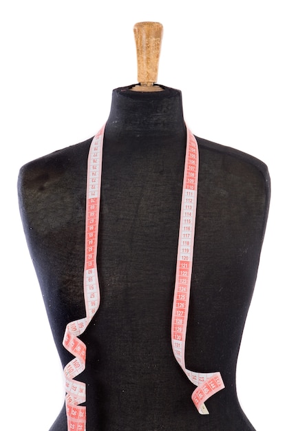 Premium Photo | Mannequin with a tape measure a over white background