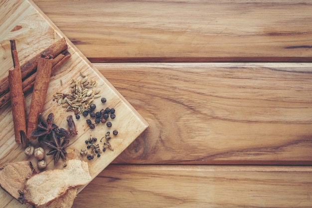 Many chinese medicines that are put together on a light brown wood floor. Free Photo