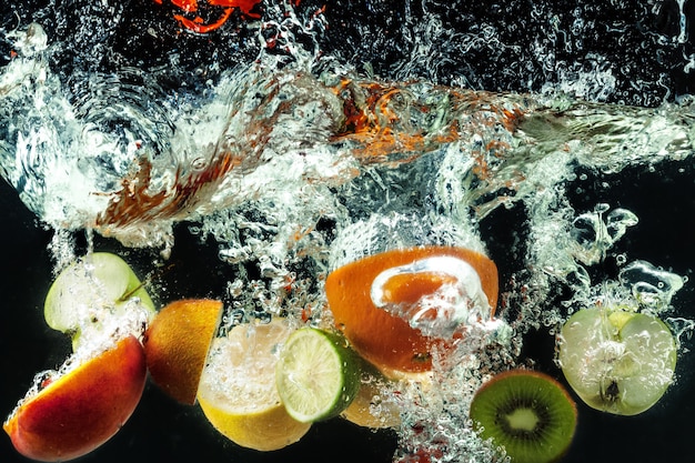 Premium Photo Many Fruits Splashes Into Water