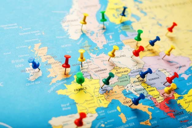 On the map of europe, the colored buttons indicate the location and coordinates of the destination Premium Photo