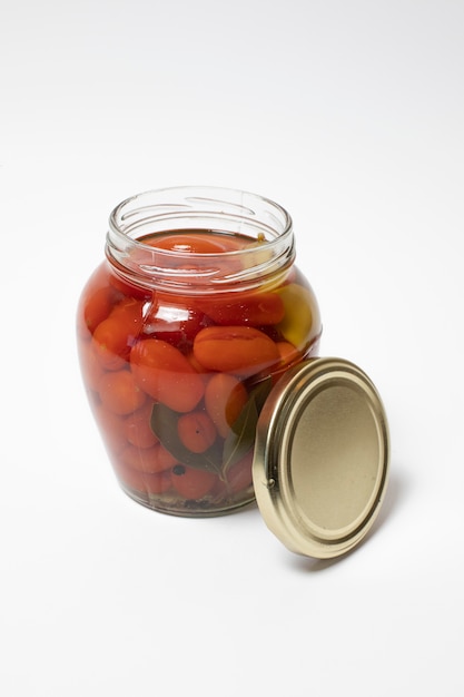 Free Photo | Marinated cherry tomatoes in a glass jar