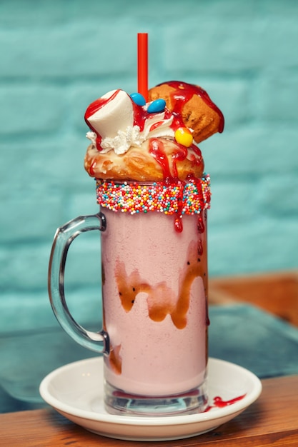 Marshmallow milk shake cocktail with whipped cream, cookies, waffles ...