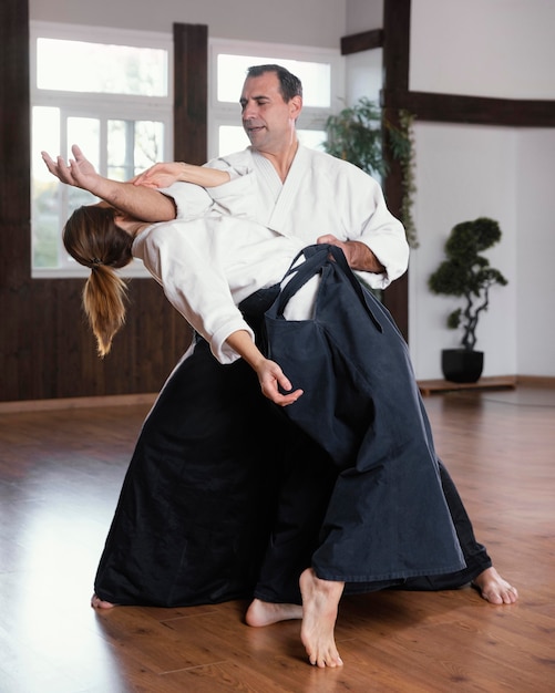 Free Photo | Martial arts instructors training in practice hall