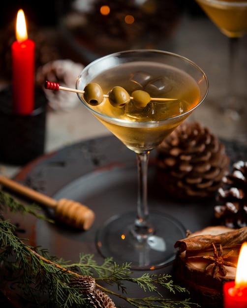 Free Photo | Martini with green olives in christmas background.